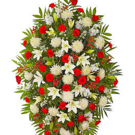Standing spray of red roses, white lilies, and white mums