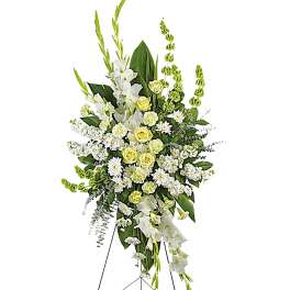 Tall white and pale yellow floral standing spray on an easel