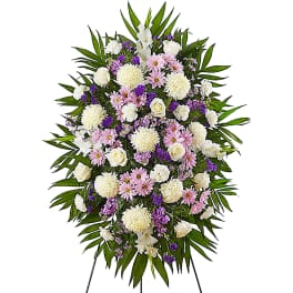 Standing floral spray with white, pink, and purple flowers