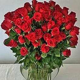 Breathless -- 100 roses arranged in a vase