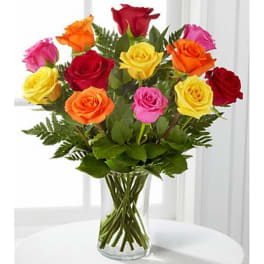 Mixed-color roses in a clear glass vase