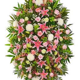 Standing spray of pink lilies, roses, and white mums on a frame