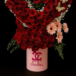 Tall red rose heart arrangement with pink daisies in a pink hatbox with gold butterfly accents