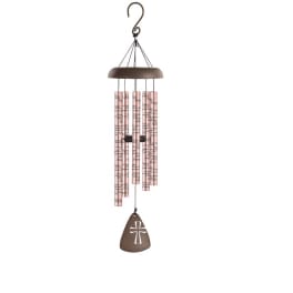 Hanging wind chime with pink tubes and a brown cross-shaped pendant