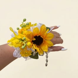 Yellow sunflower wrist corsage with ribbon and dangling beads