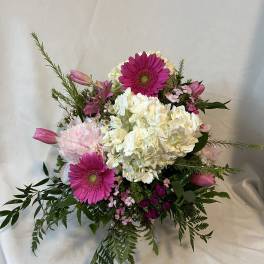 Pink gerberas and white hydrangeas in a mixed bouquet