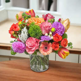 Colorful mixed bouquet in a clear glass vase