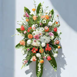 Large floral spray with orange, pink, and white blooms