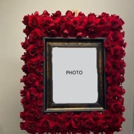 Red rose frame surrounding a central photo opening