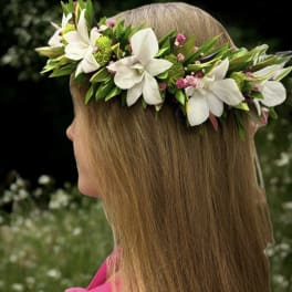 Girl wearing a white and green flower crown