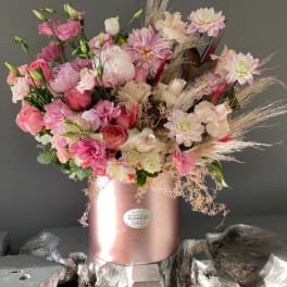 Pink and cream mixed bouquet in a rose-gold box vase