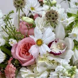 Pink rose bouquet with white flowers and green filler