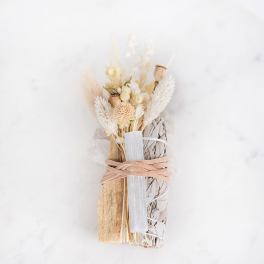 Dried floral bundle with white and beige accents tied with ribbon