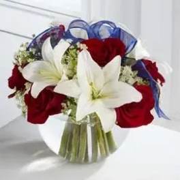 Bouquet of red roses and white lilies with blue ribbon wrap
