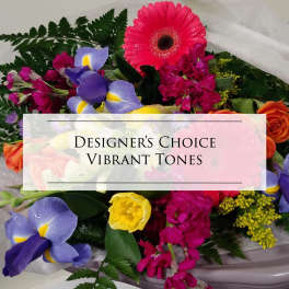 Vibrant mixed bouquet with gerbera, roses, iris, and yellow blooms