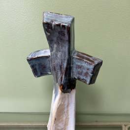 Ceramic cross wall hanging with blue, brown, and white glaze