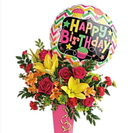Birthday bouquet with roses, lilies, and a Happy Birthday balloon