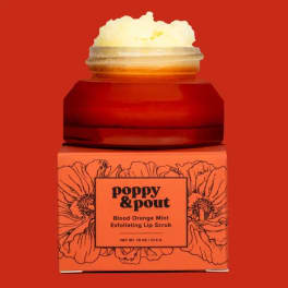 Jar of lip scrub in an orange box with floral line art
