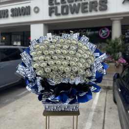 Large bouquet of folded dollar bills with blue and white designer wrapping