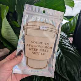 Packaged greeting card with a coffee cup design and bold text