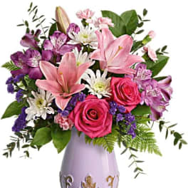 Pink and purple mixed bouquet in a lavender vase