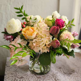 Mixed pastel bouquet in a clear glass vase