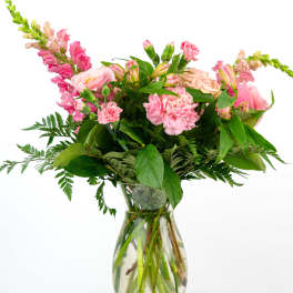 Pink mixed bouquet in a clear glass vase