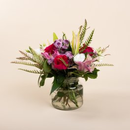 Mixed pink and white bouquet in a clear glass vase