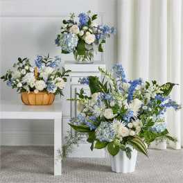 Blue and white floral arrangements in a vase and basket