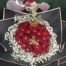 Red rose bouquet with white baby's breath and butterfly accents
