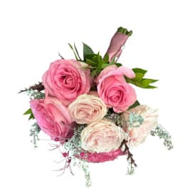 Pink and cream rose bouquet with greenery on a white background