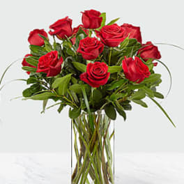 Bouquet of red roses in a clear glass vase