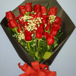 Bouquet of red roses with white baby's breath and a red ribbon