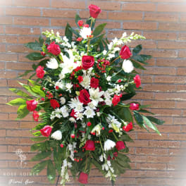 Large standing floral spray with red roses and white flowers