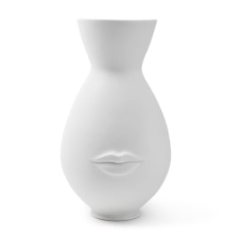 White sculptural vase with a face and lips