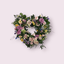 Heart-shaped floral wreath with pastel roses and chrysanthemums