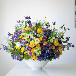 Colorful mixed bouquet in a white vase