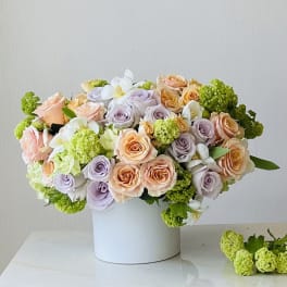 Pastel rose bouquet in a white box vase