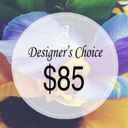 Designer’s choice $85 floral arrangement graphic over colorful petals