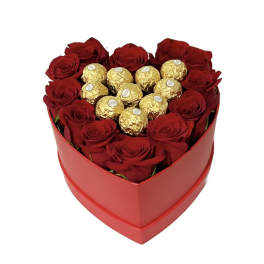 Heart-shaped box of red roses topped with gold-wrapped chocolates