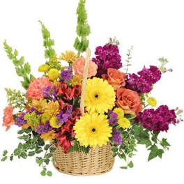Colorful mixed flower basket with yellow daisies and orange roses