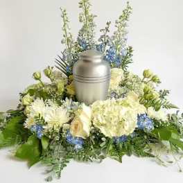 White and blue floral urn arrangement with a silver urn centerpiece