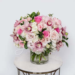 Pink and white mixed bouquet in a clear glass vase