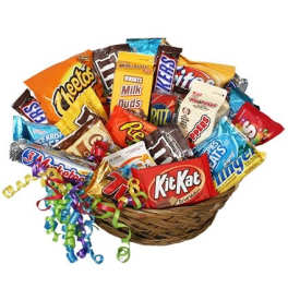 Basket filled with assorted candy bars and colorful curling ribbons