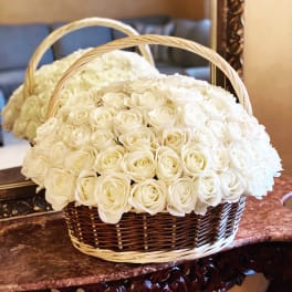 Basket of white roses with arched handles