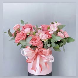 Pink rose bouquet in a pale pink box with a ribbon bow