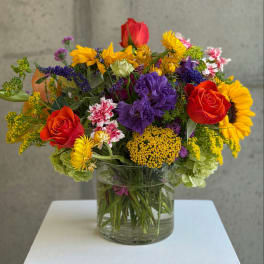 Colorful mixed bouquet in a clear glass vase
