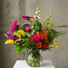 Colorful mixed bouquet in a clear glass vase