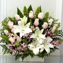 Bouquet of white lilies, pale pink roses, and pink alstroemeria