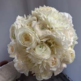 Bouquet of white flowers held in hand